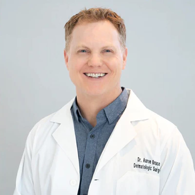 Headshot of Aaron Michael Bruce, DO, FAAD, FACMS, FAOCD, board-certified dermatologist at Montana Skin Cancer and Dermatology Center P.C., dba SkinCare MT