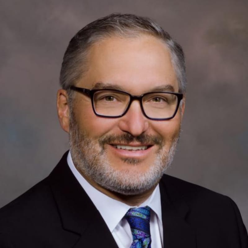 Headshot of Christopher Timberlake Aleman, MD, board-certified dermatologist at Forefront Dermatology